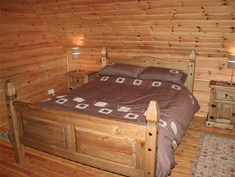 wildwood log cabin master bedroom